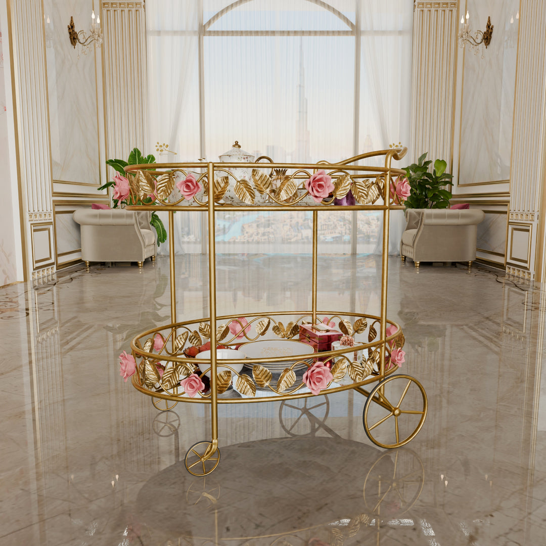 Juliet serving trolley with floral metalwork, glass top, and antique mirror shelf.