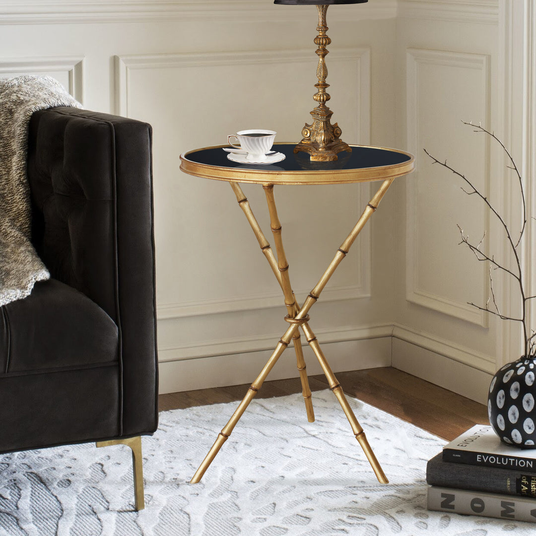 Myra side table with bamboo-inspired verticals and black glass top.