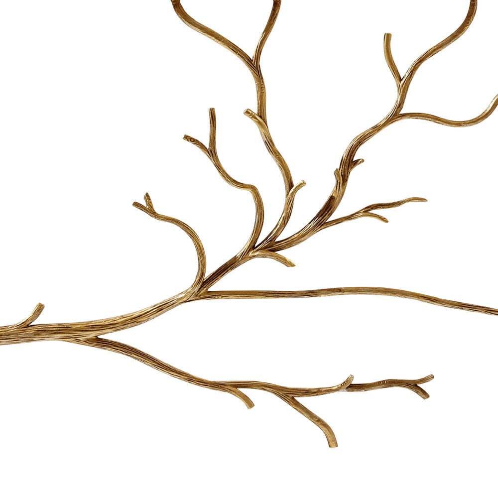 Close up of luxurious console table showing organic branches made of forged metal inspired by nature