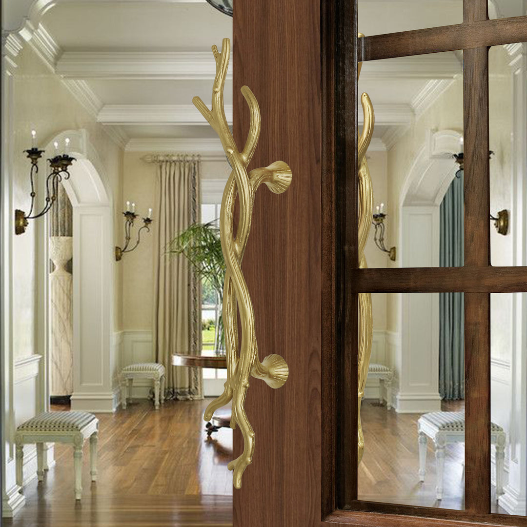 Amalfi door handles with twisted branch design installed on wooden doors