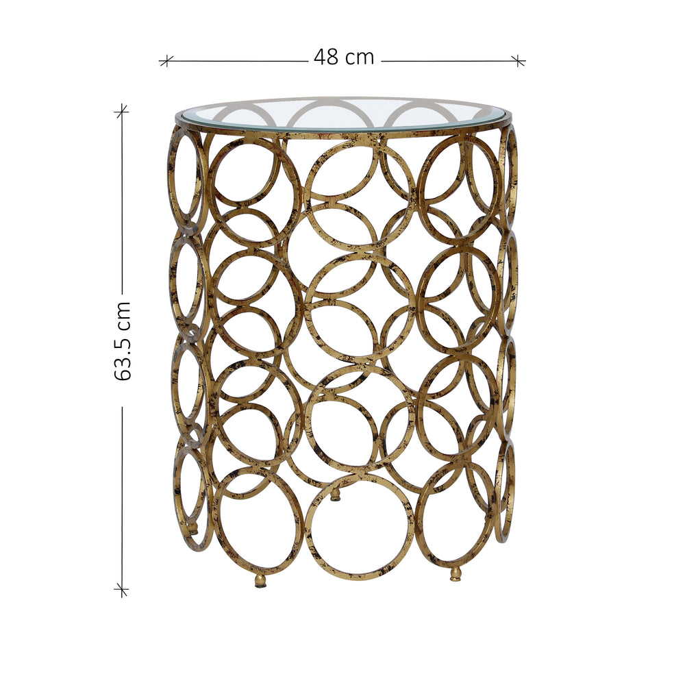 A novelty end table comprised of 40 metal rings in antique golden finish topped with clear glass