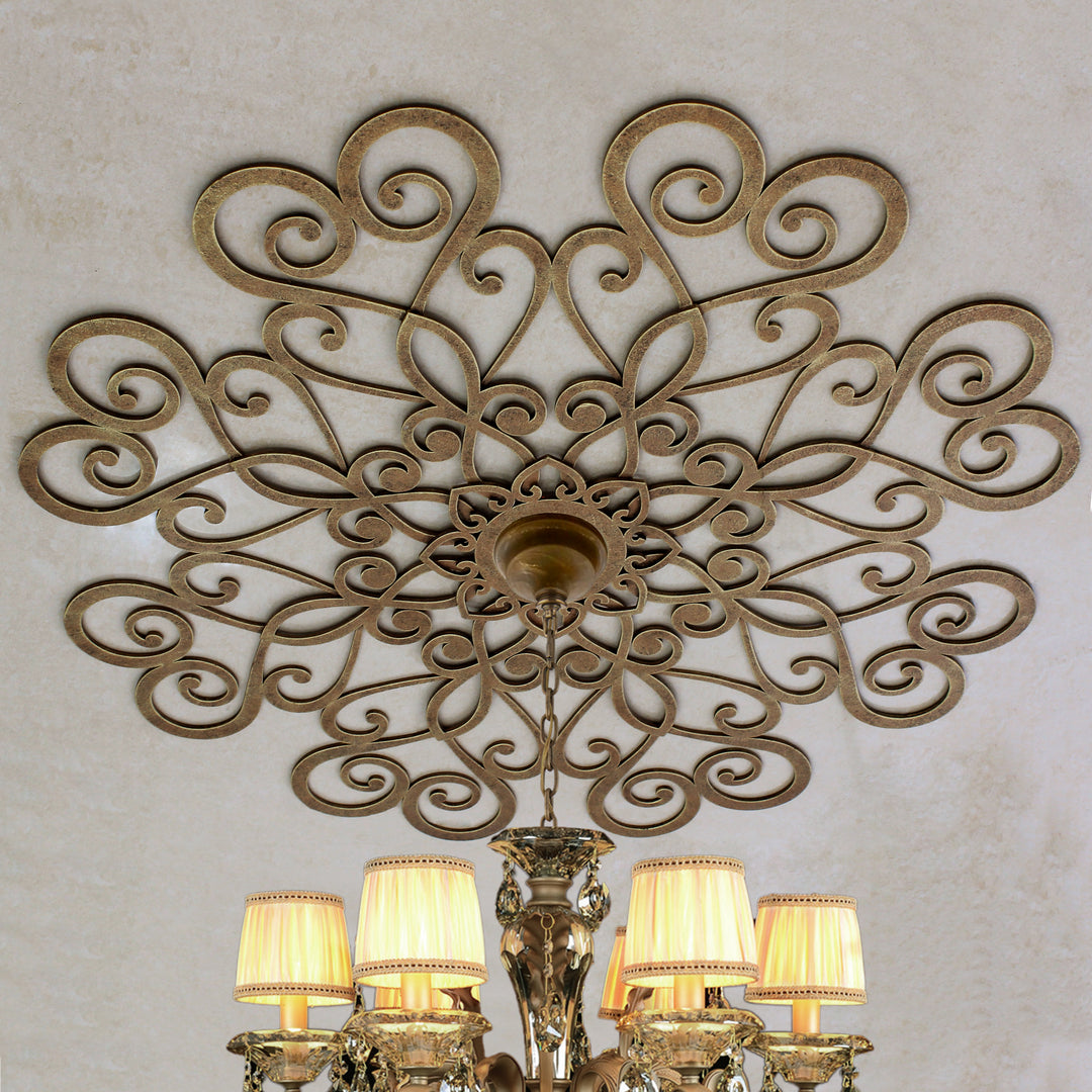 Cupido ceiling medallion with antique gold scroll pattern above chandelier