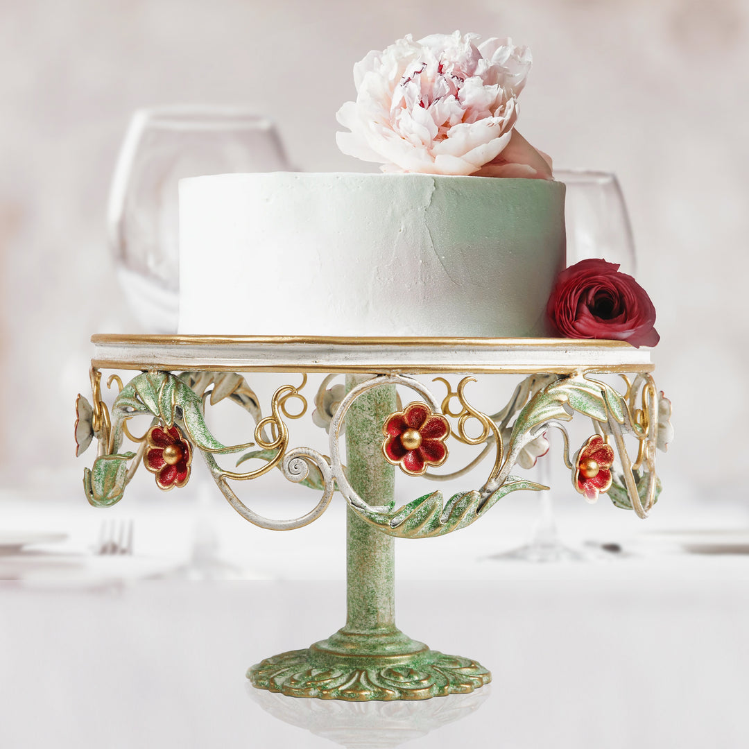 Flora decorative cake stand with red floral accents and sculpted pedestal