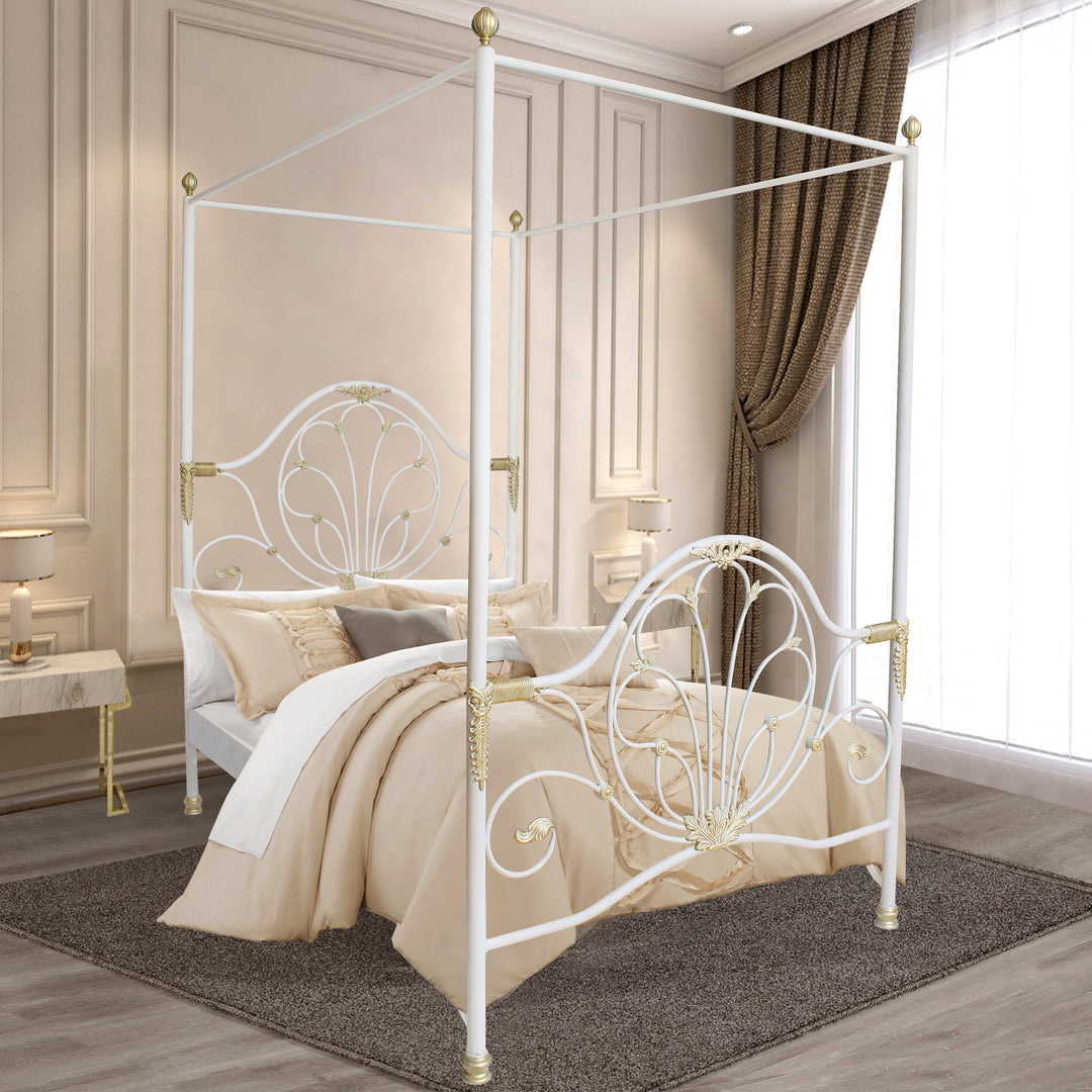 Wrought iron canopy bed with decorative scrollwork and gold accents