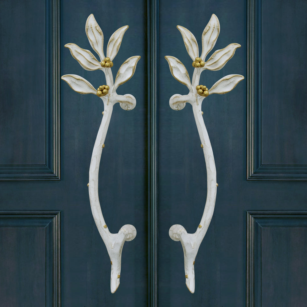 Laurel door handles with sculpted leaves and curved botanical form by Choufani