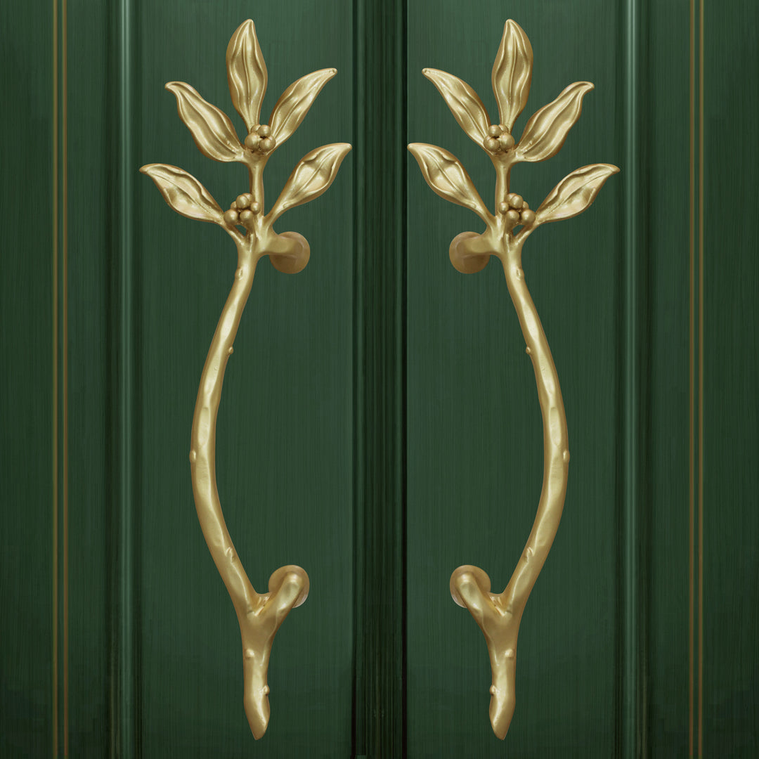 Decorative door handles with bay leaves painted in gold