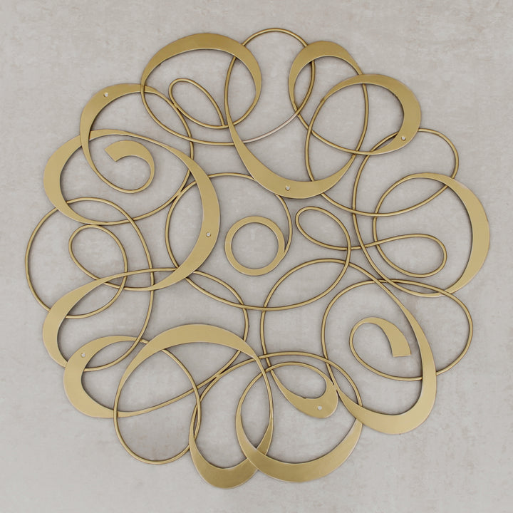 Decorative metal ceiling medallion with an organic pattern, painted in a golden finish