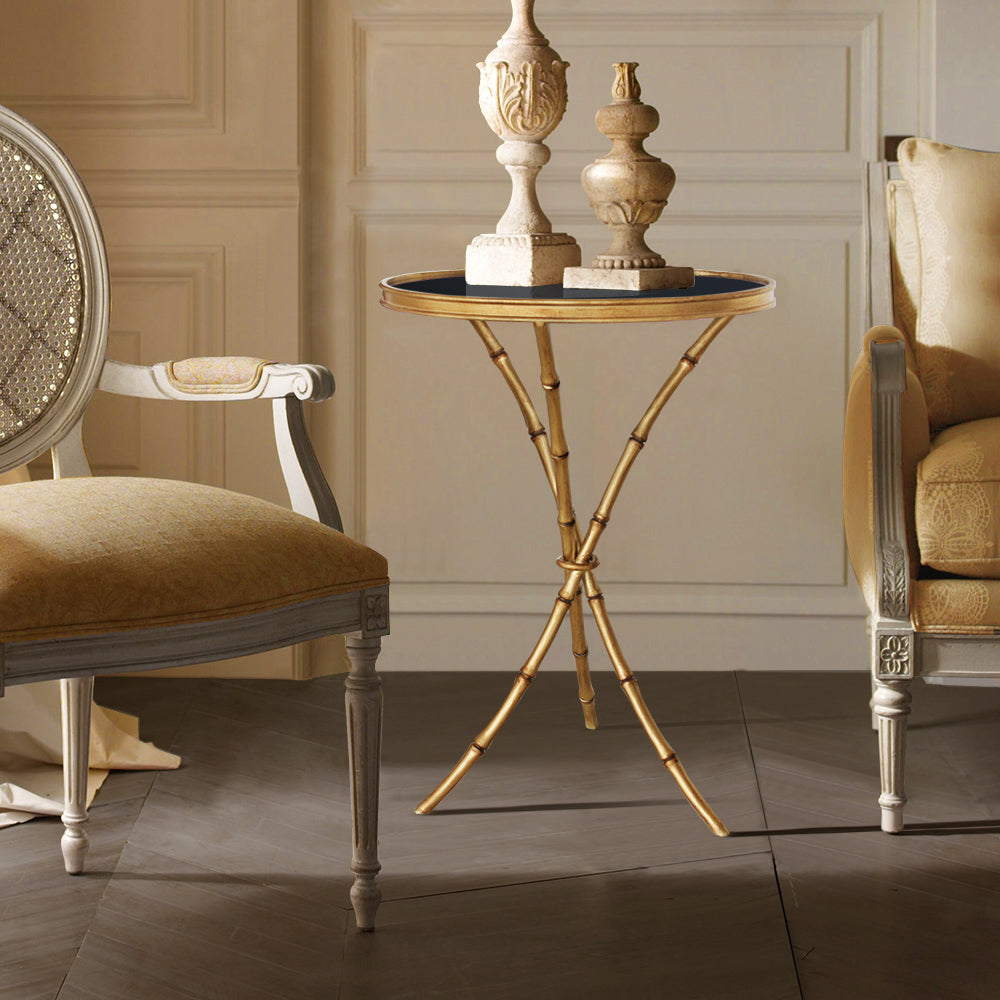 Luna side table with bamboo-inspired legs and black glass top.