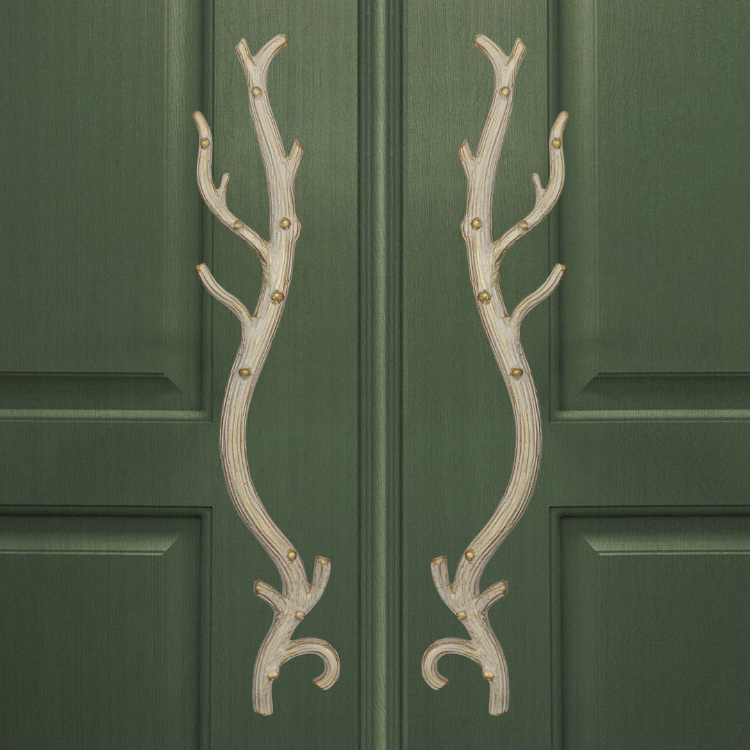 Oro door handles with sculpted branch silhouette and elongated form by Choufani