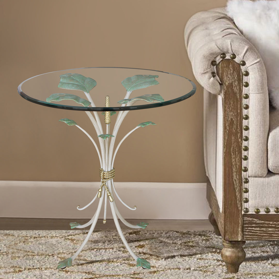 Raya side table with sculpted botanical base and circular glass top by Choufani