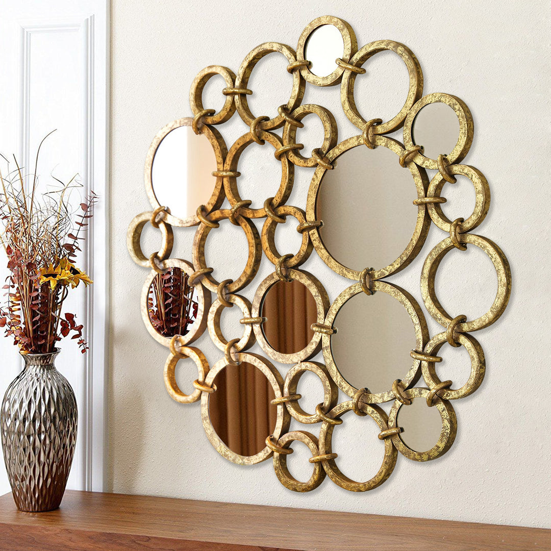 Ronda round wall mirror with interlocking gold metal rings