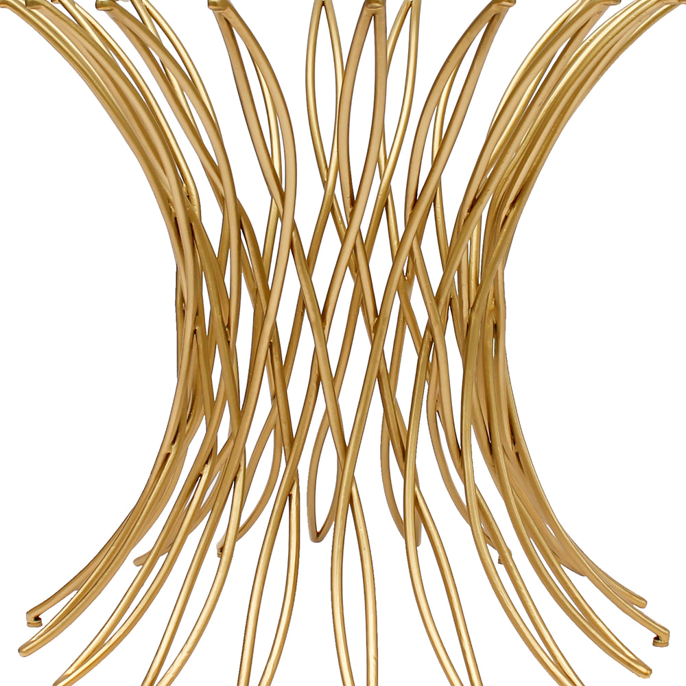 Close up of the base of a contemporary entrance table made from an intricate weave of golden metal bars