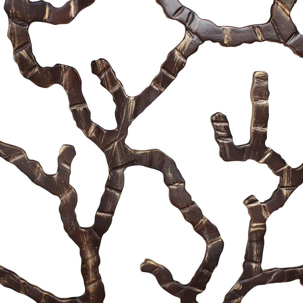 Close up of base of a luxurious console with an organic branch design painted in an antique bronze finish