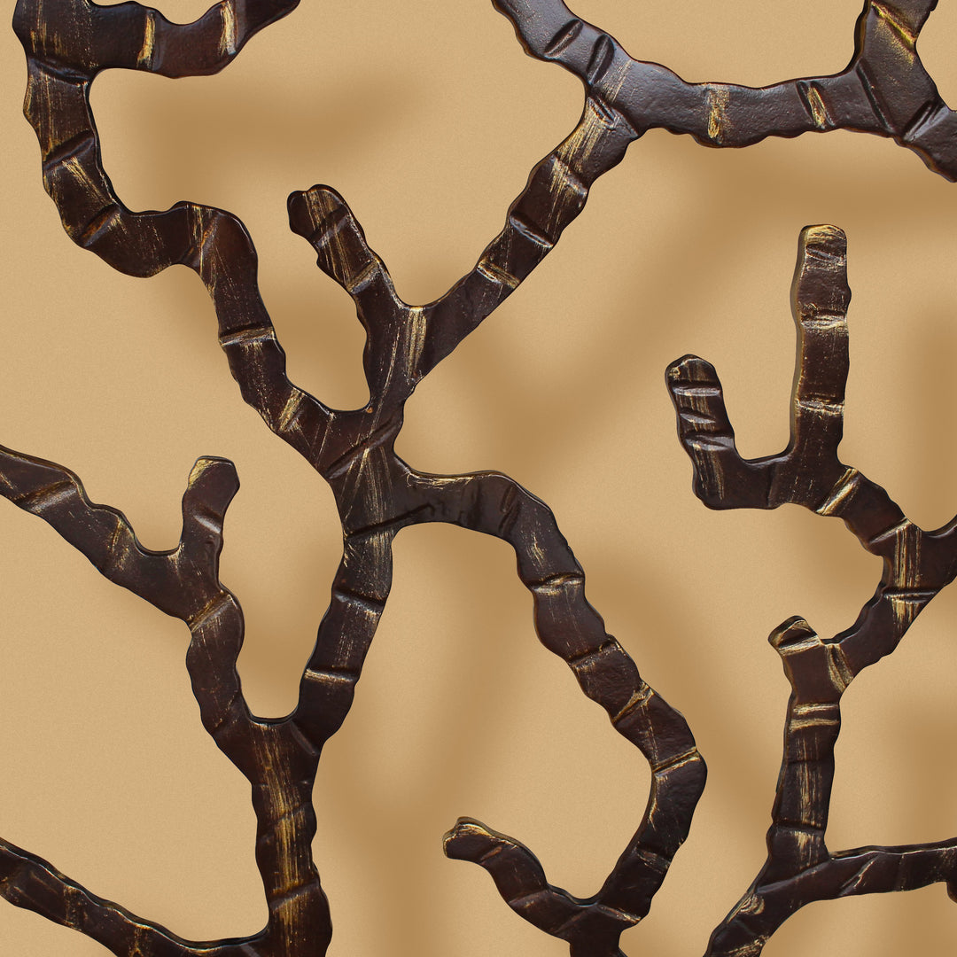 Close up detail of Coral branches of the console table on a beige wall