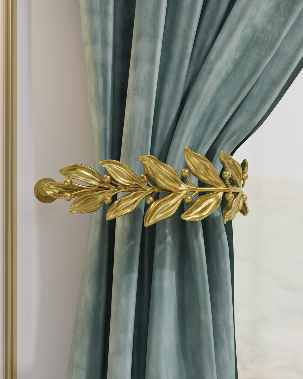 Gold curtain holdback with leaves and buds holding a velvet curtain in place