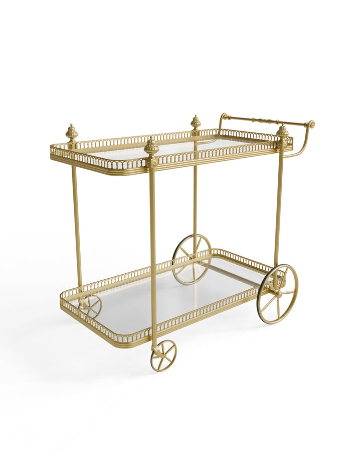 Angled view of the Alicia gold serving trolley highlighting decorative frame and wheels