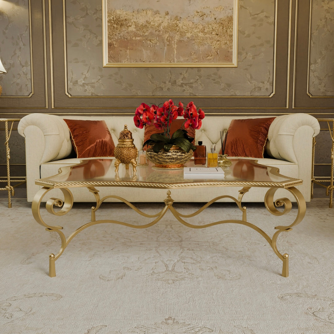 Front view of Regina coffee table styled with accessories and gold accents