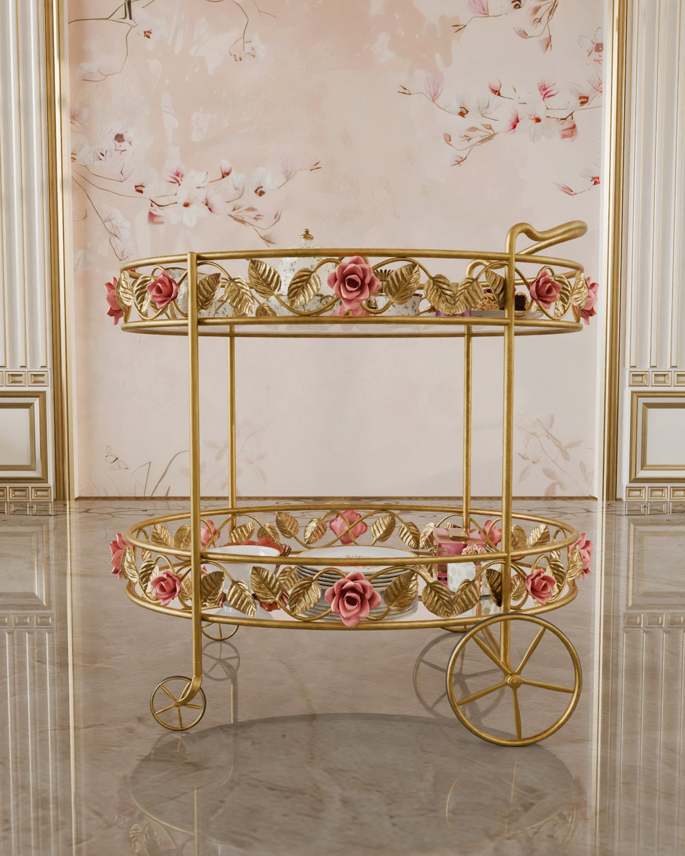Front view of the Juliet serving trolley in gold, featuring hand-forged pink roses, leaf motifs, and double glass shelves