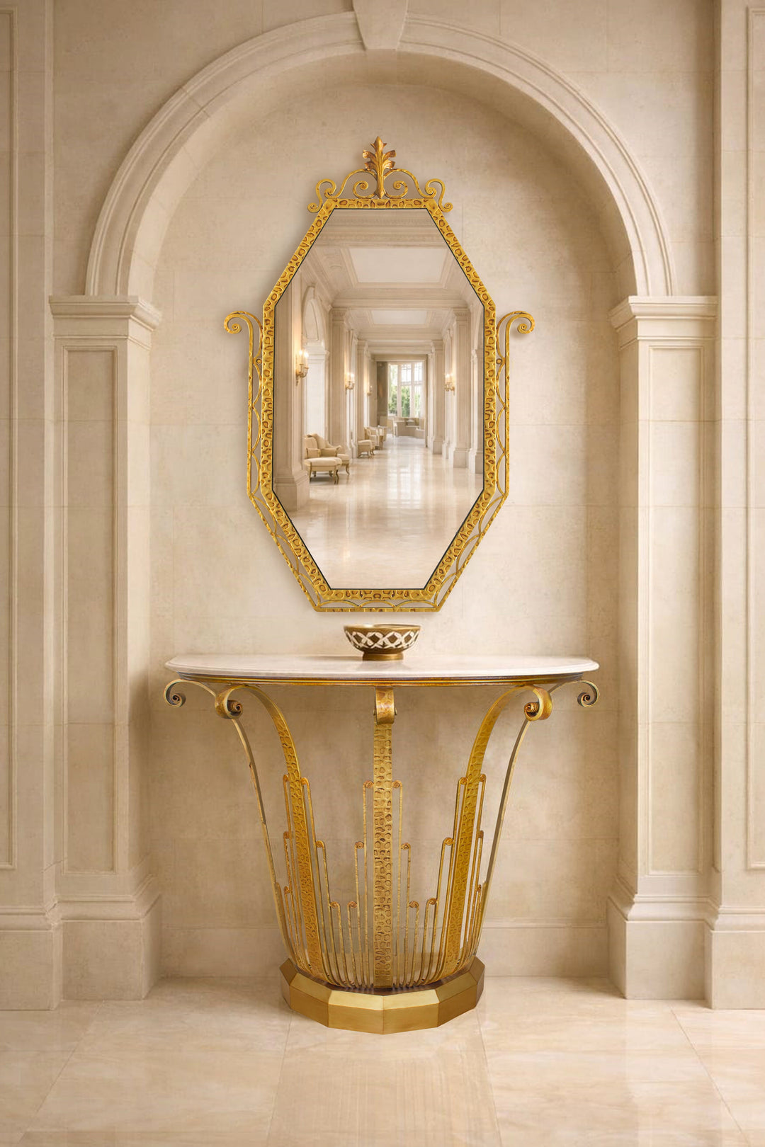 Lily art deco inspired console table and mirror in gold metal with marble top, styled beneath a classical arched niche in an elegant luxury interior