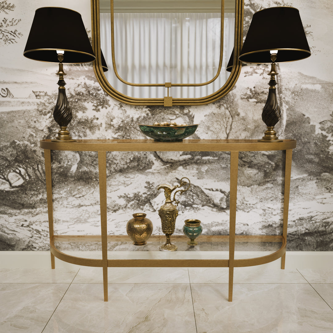 Front view of modern gold console and matching mirror styled with dark lamps, accessories and scenic wallpaper backgroud