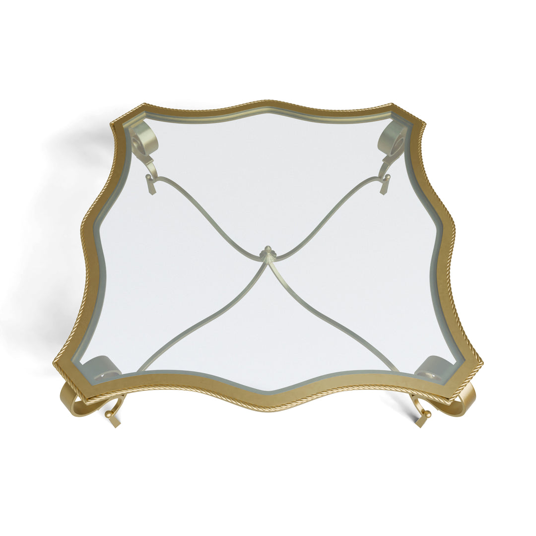 Top view of Regina table with contoured glass and decorative frame