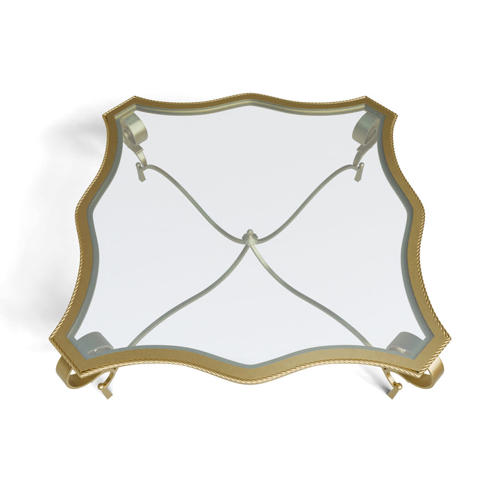 Top view of Regina table with contoured glass and decorative frame