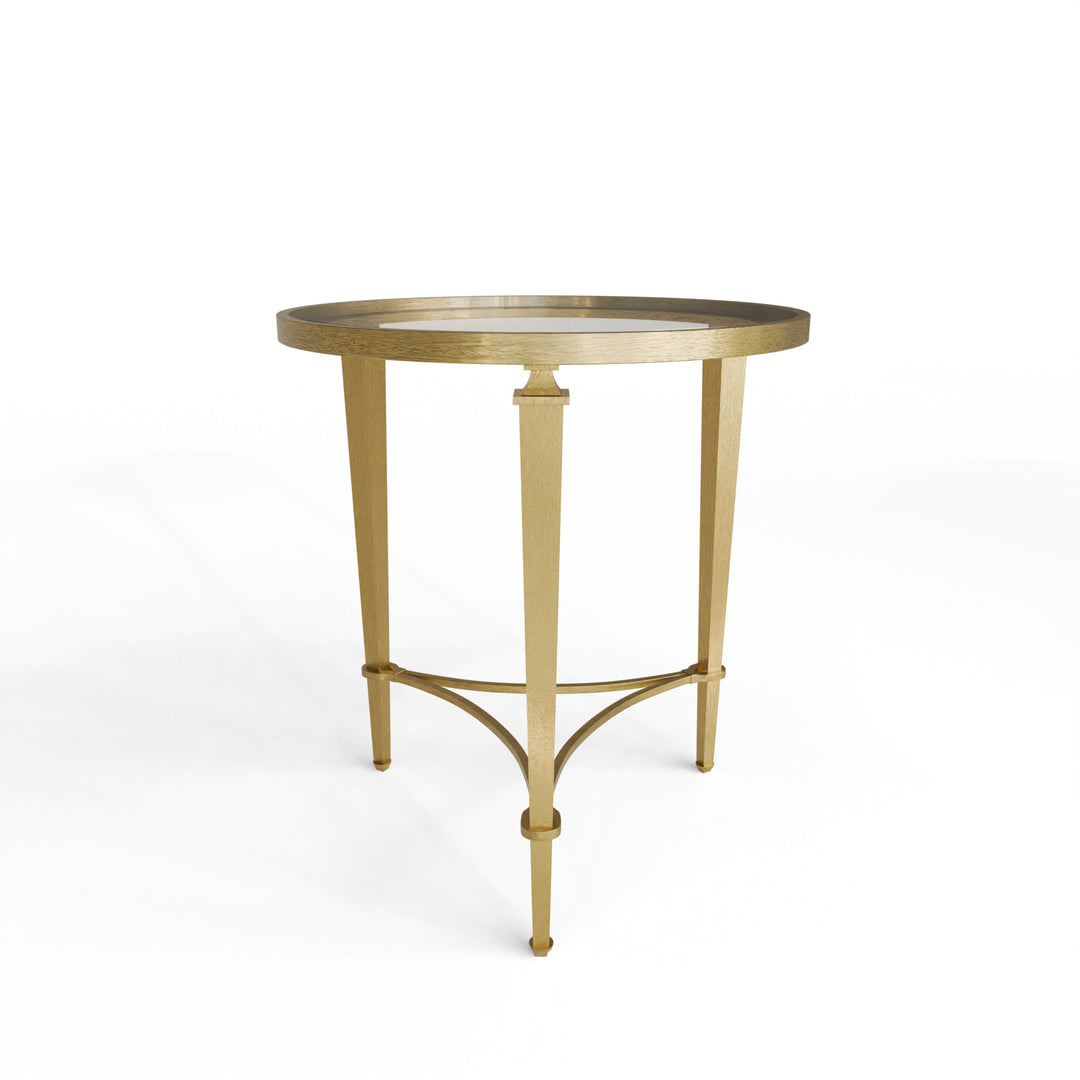 Gold side table with glass top on a white background