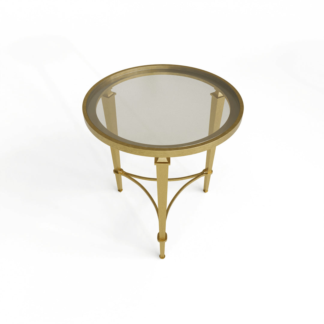 Top view of round glass side table with gold metal frame on a white background