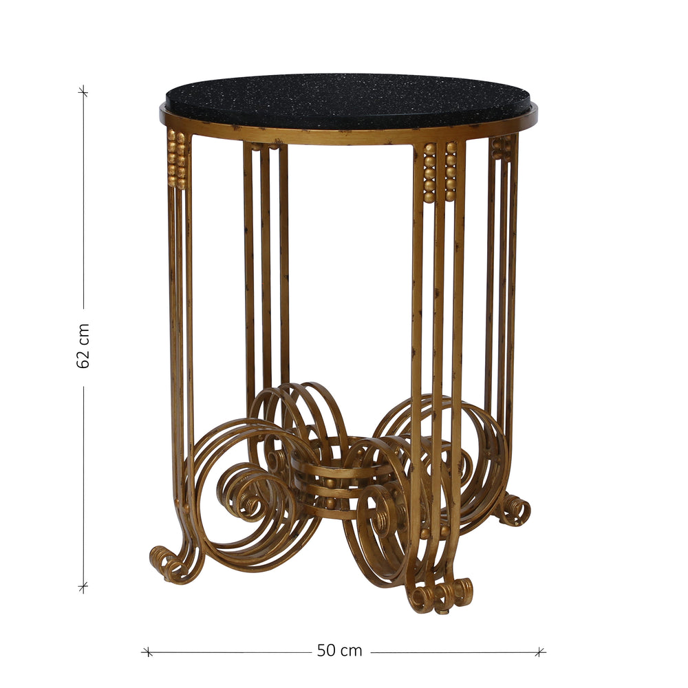 A unique 'Art Deco' style side table in an antique gold finish topped with a round black granite