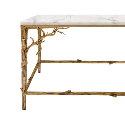 Close-up shot of a luxury coffee table's legs, inspired by branches and painted in an antique champagne finish