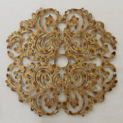 Decorative metal ceiling medallion with a lace pattern, painted in an antique golden finish