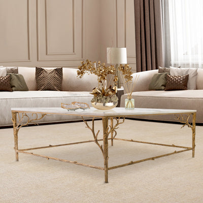 Luxury center table inspired by nature's branches sits in a contemporary living room topped with white natural marble