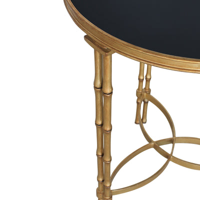Close up of an accent table with bamboo shaped legs