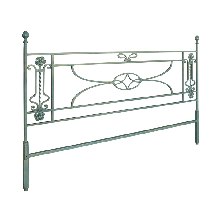 A simple classical wrought iron headboard with scrolls and flowers painted in a pastel blue color; with annotated dimensions