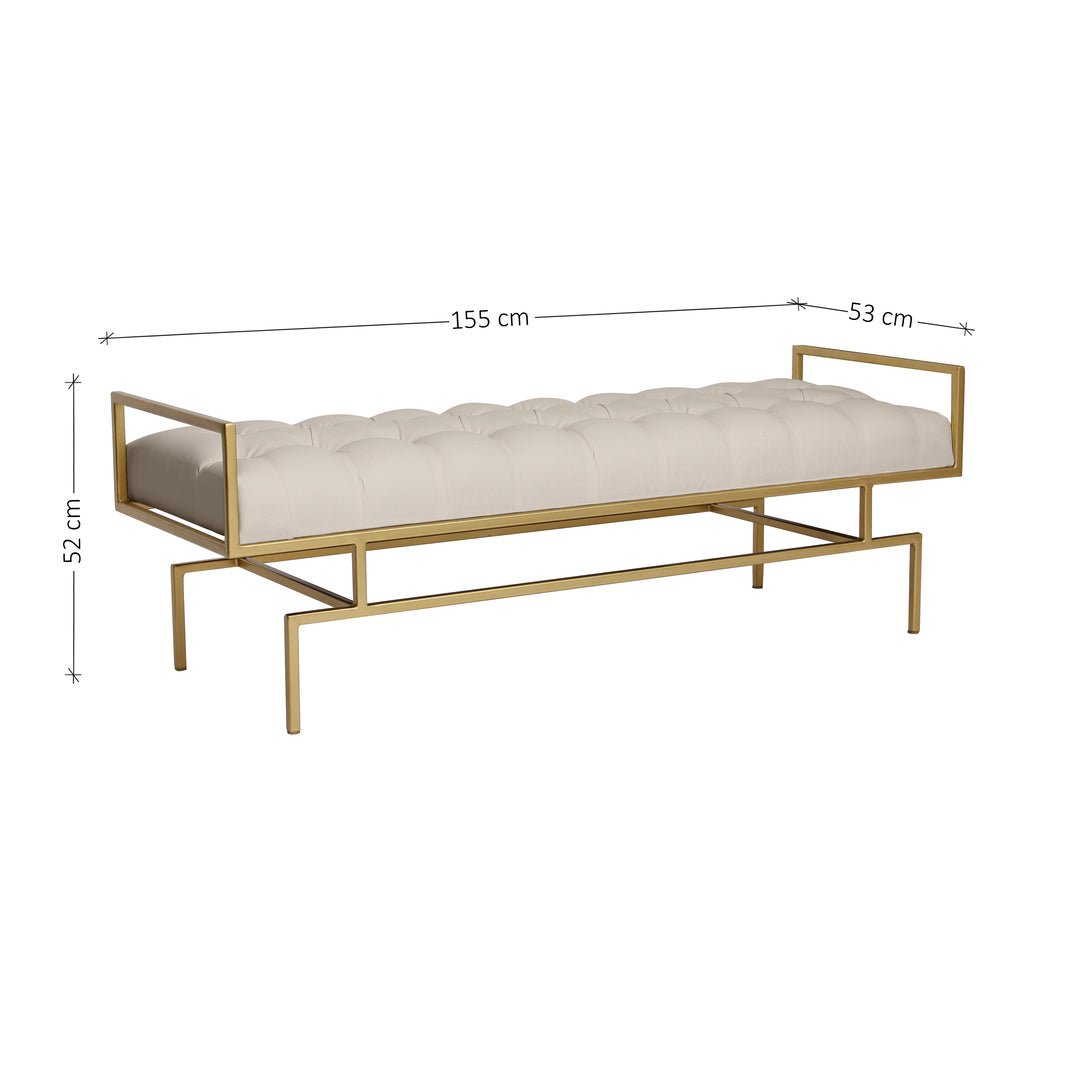 A contemporary metal golden bench with modern styled legs, topped with a white leather capitone cushion; with annotated dimensions