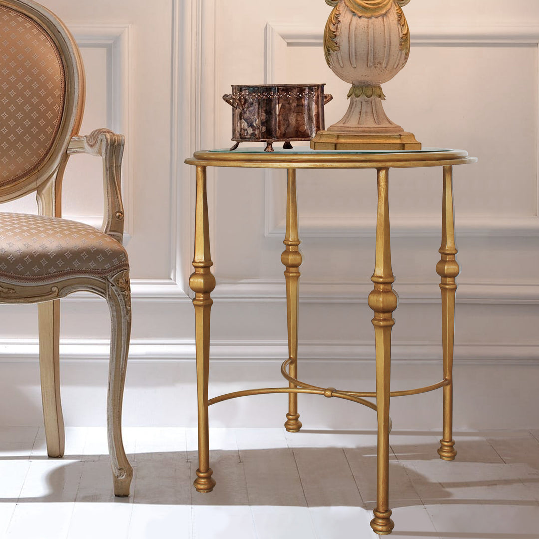 Classical circular side table with glass top painted in antique gold color