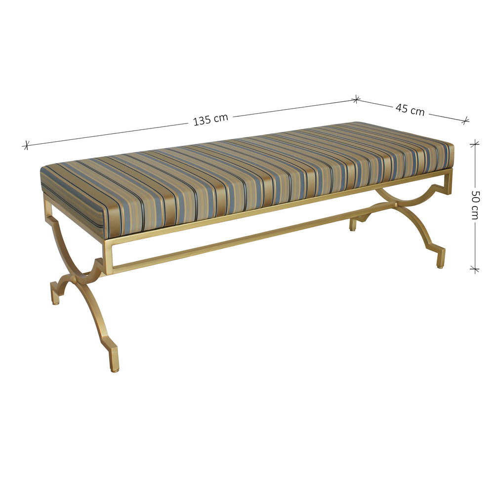 A modern bench with a gold base and blue striped silk upholstery; with annotated dimensions