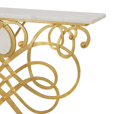 Close up of a unique wrought iron console table with gold leaf finish, topped with white marble