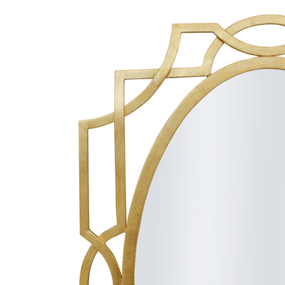 Close up of a unique oval shaped mirror with an Art Deco style and gold leaf finish