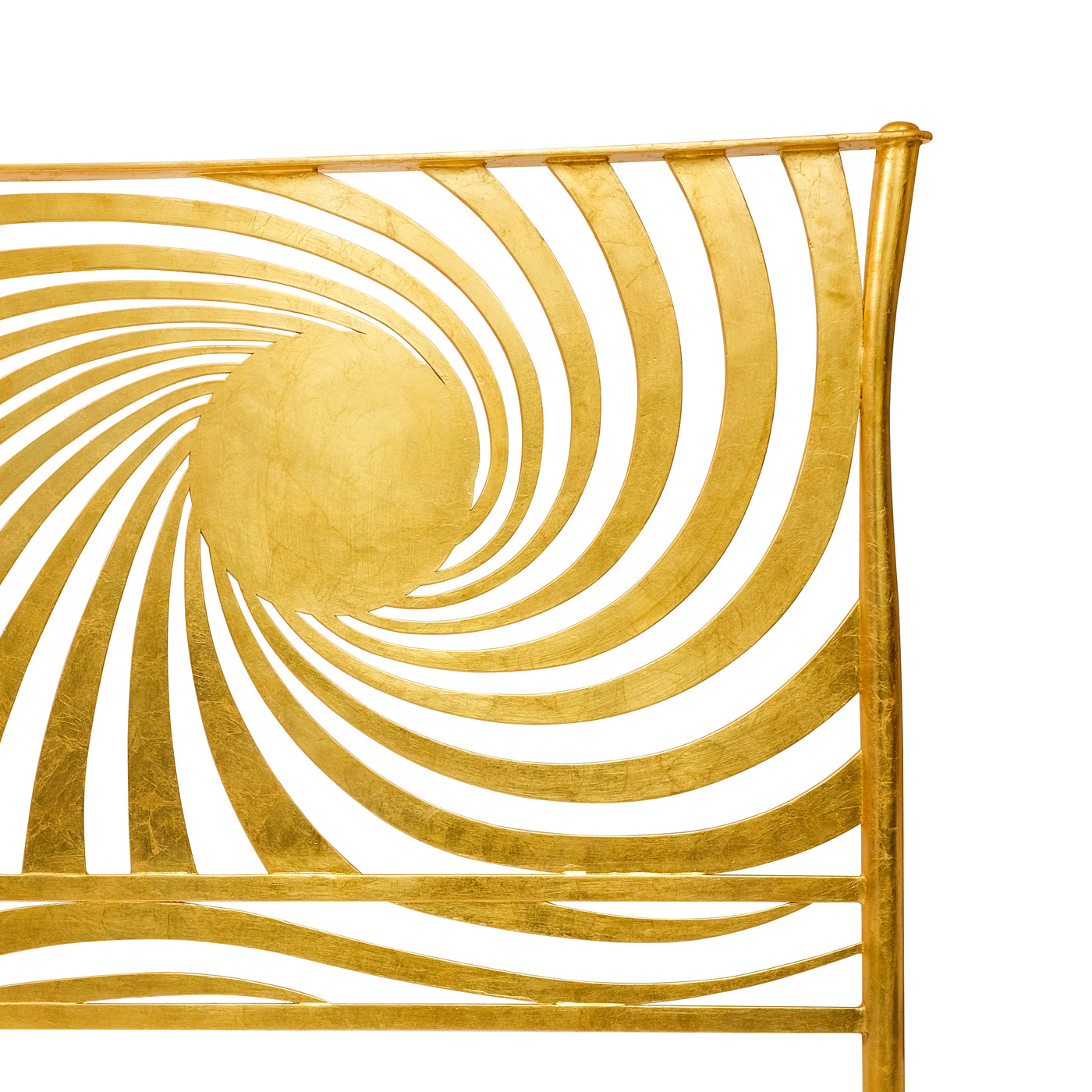 Close up of a modern double bed headboard inspired by the sun in a sparkling gold leaf finish