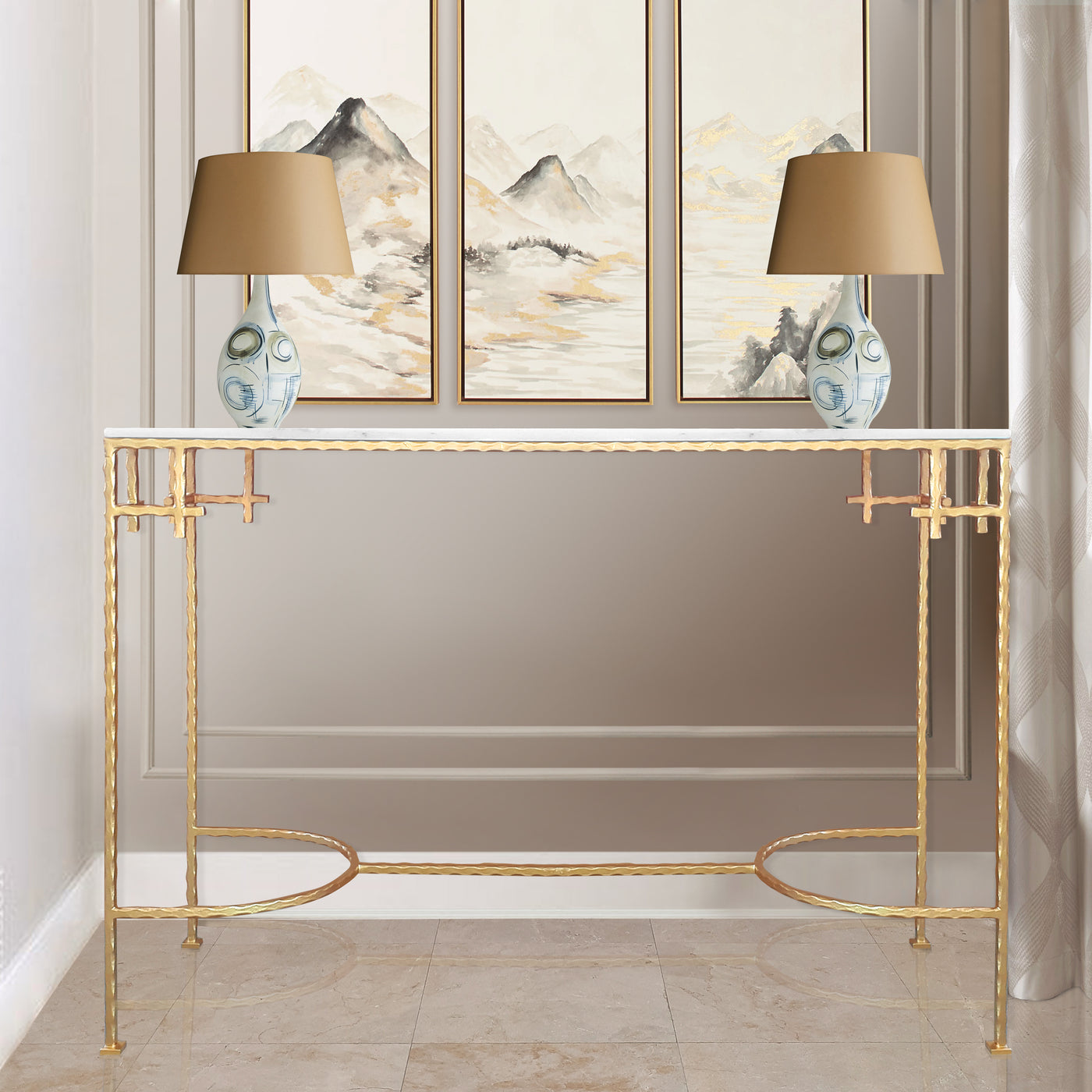 A contemporary golden console with a white marble top in a modern living space