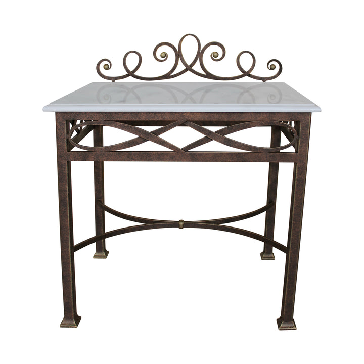 A whimsical night table made of metal painted in antique bronze and topped with marble