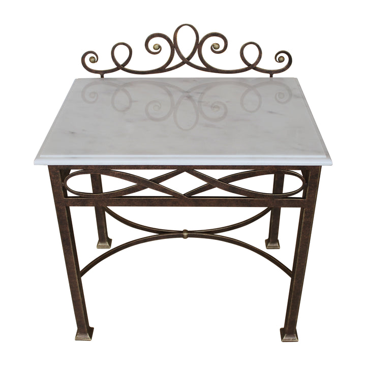 A unique metal nightstand painted in antique bronze and topped with white marble