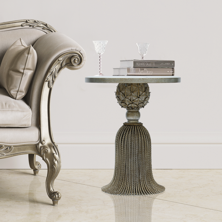 Luxury antique-silver accent table inspired by the curtain tassel topped with a white marble in a classical living space