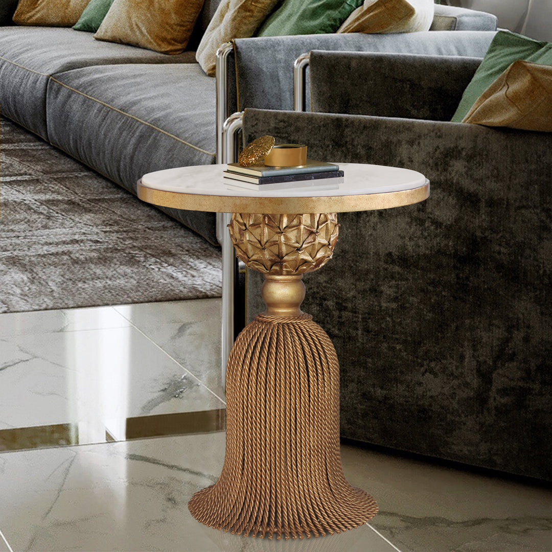 Novelty golden end table inspired from the curtain tassel topped with a white marble in a contemporary living room