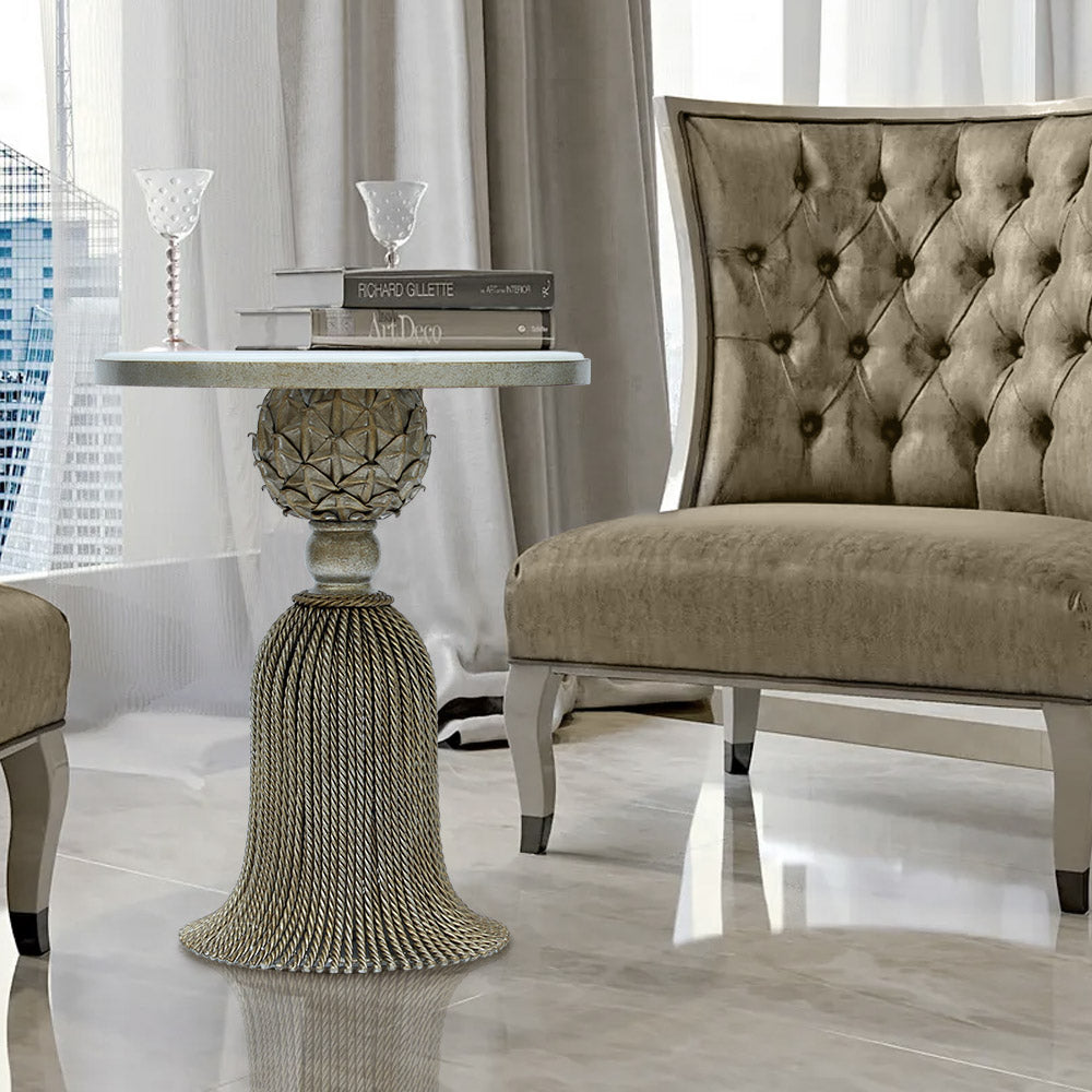 Unique silver side table inspired by the curtain tassel topped with  natural marble in a contemporary living room