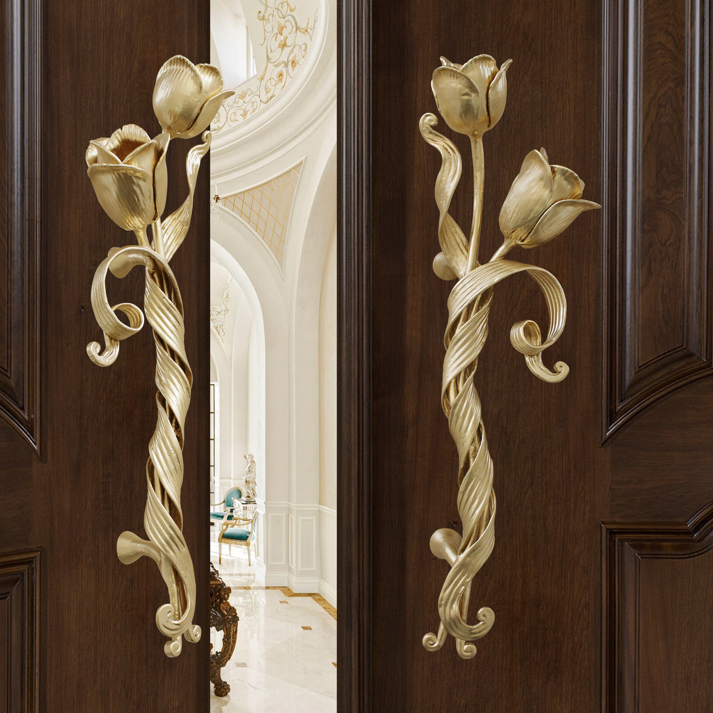 Pair of golden decorative pull handles inspired by tulips mounted on an opened wooden door