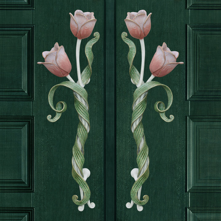 Pair of decorative pull handles inspired by tulips mounted on a closed green door
