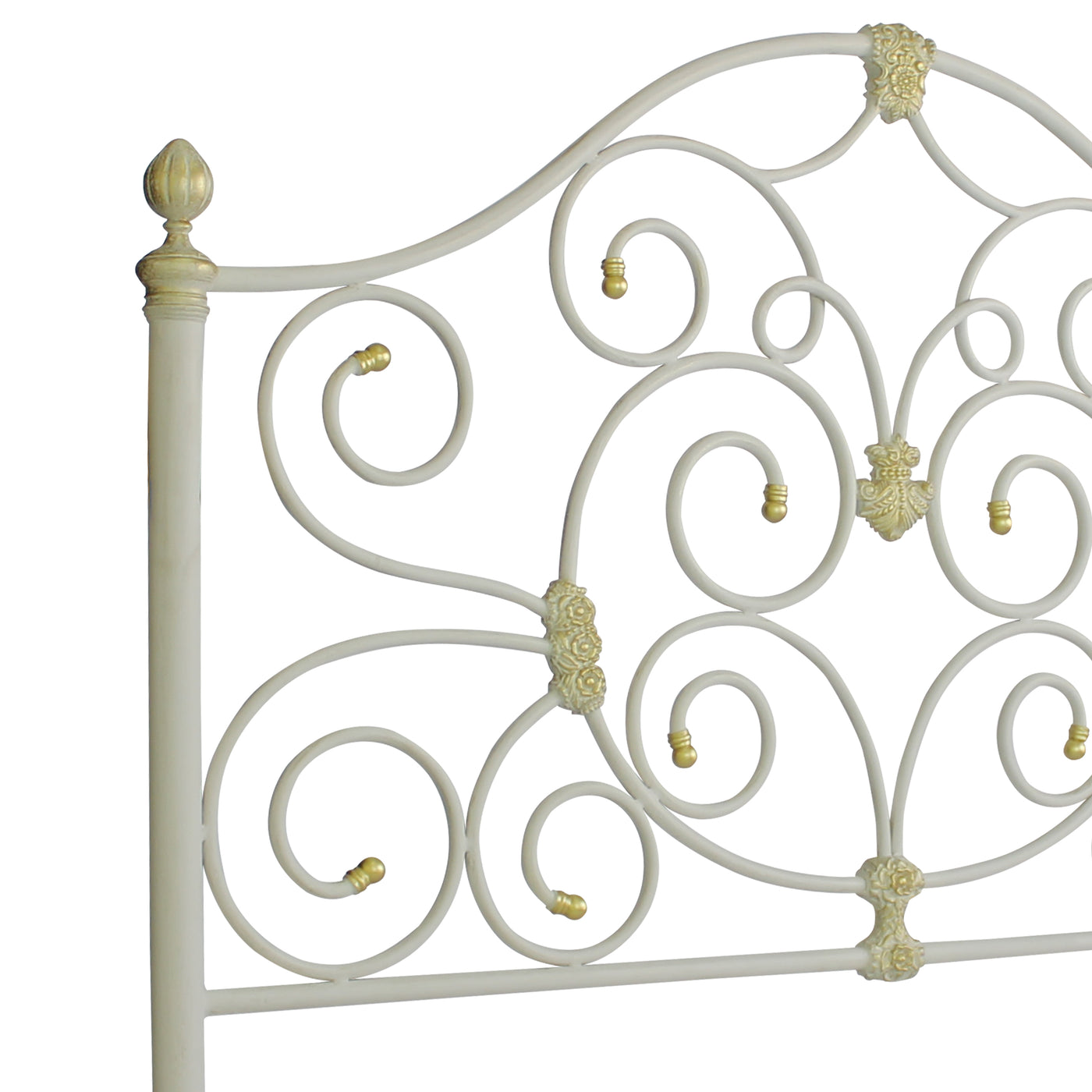 Close up of a wrought iron headboard for a single bed with scrolls and classical motifs, painted in white and gold
