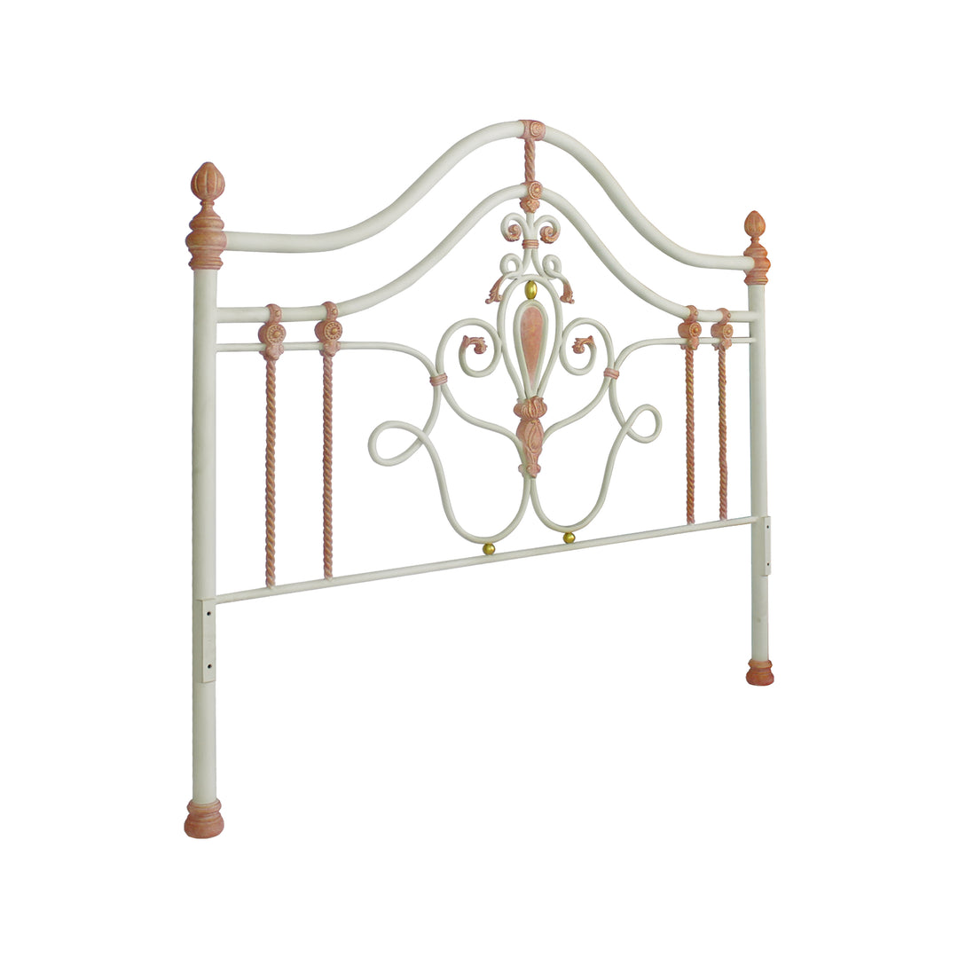 Wrought iron headboard for girls single bed with scrolls, leaves and motifs painted in white, pink and hints of gold